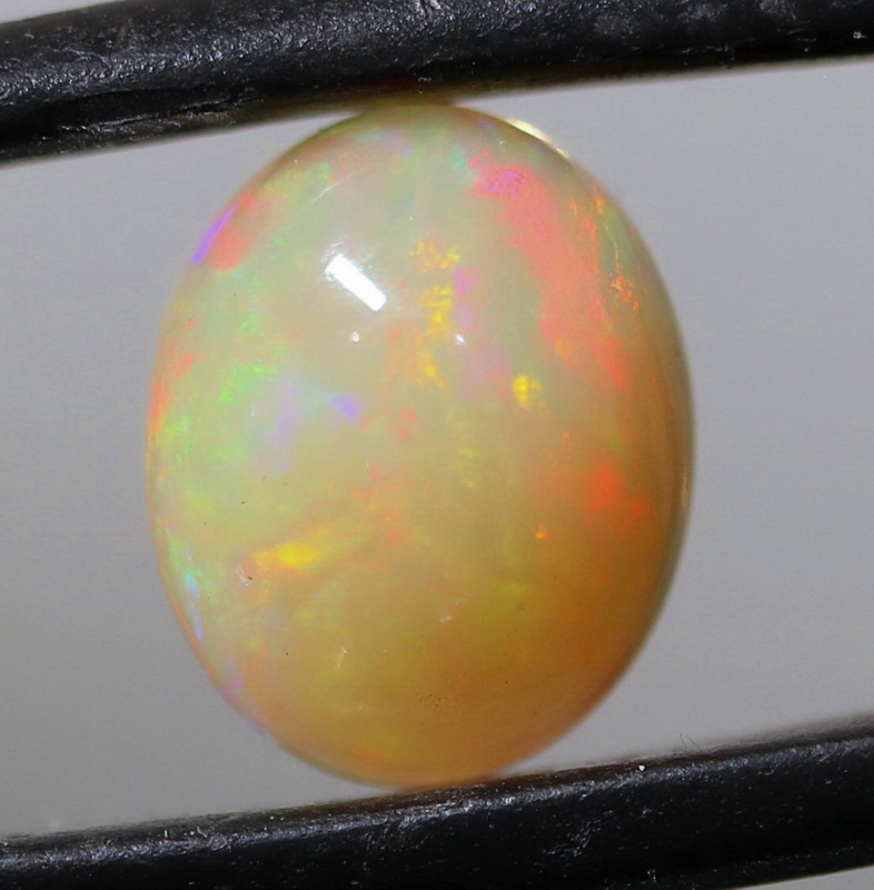 Brilliant flashing 1.83ct semi-black Opal