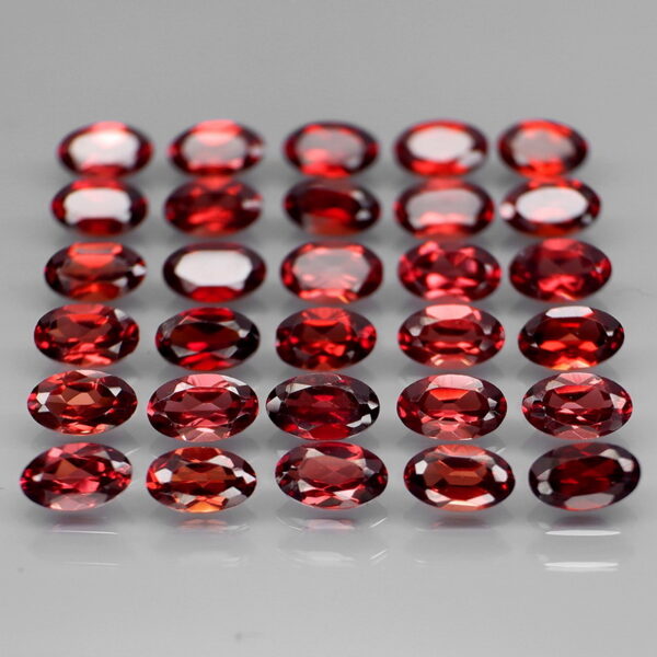 Stunning 8.67ct oval cut red Garnet set