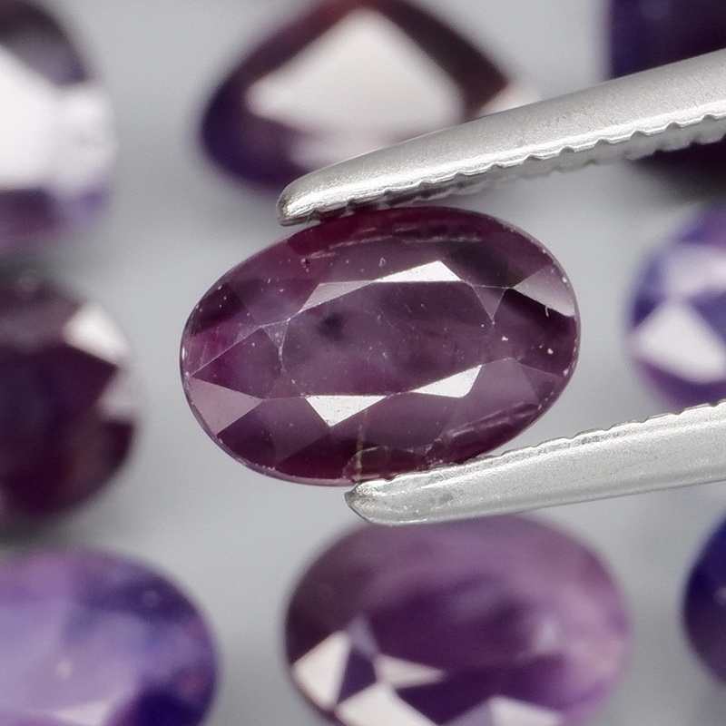 Stunning violet 8.88ct mixed cut Sapphire set