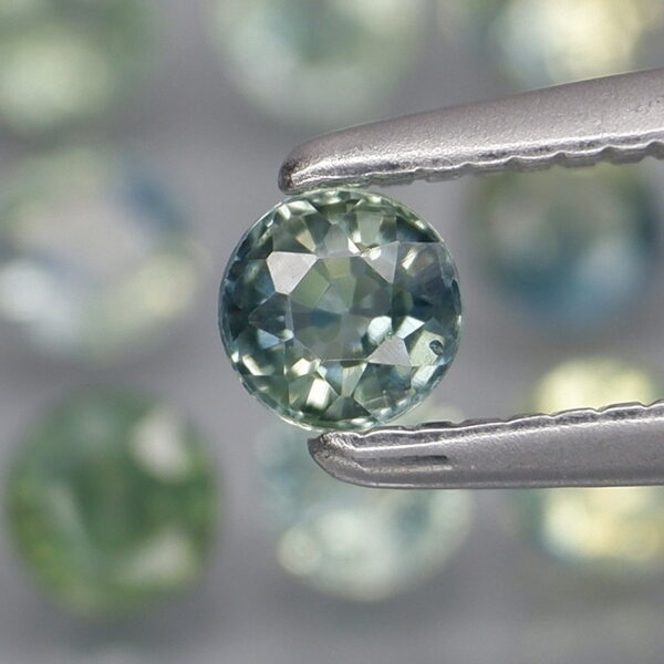 Heated only! 3.32ct blue green Sapphire set