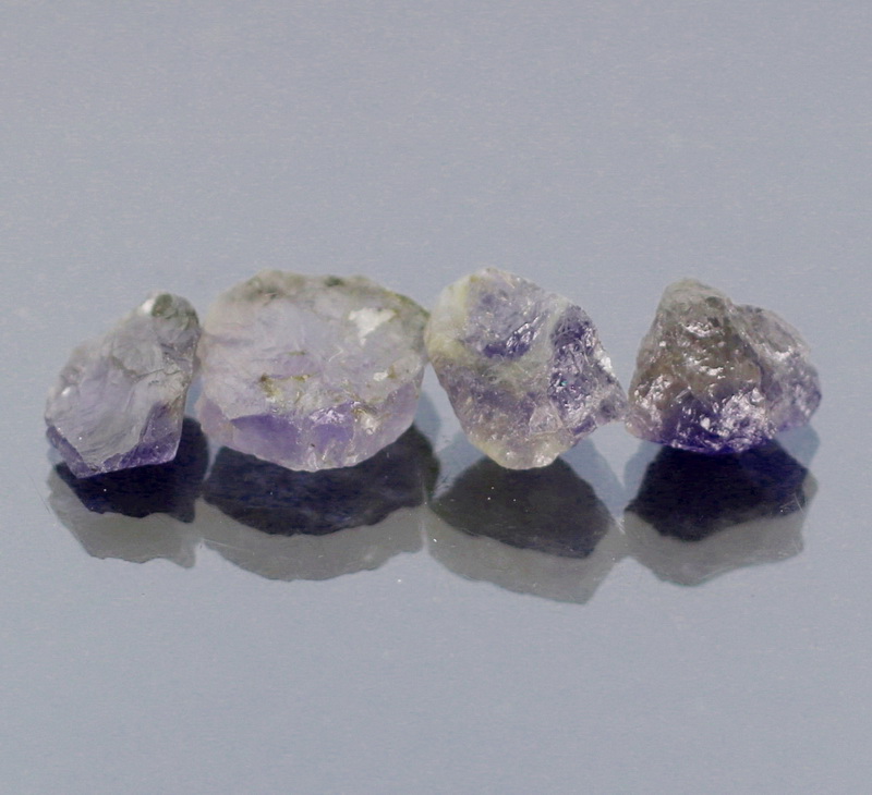 Superb 10.86ct blue violet uncut Iolite set