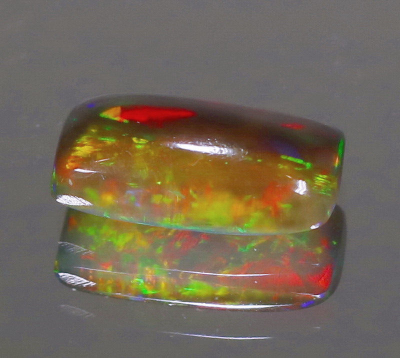Fiery flashing 1.30ct Ethiopian bi-color Opal