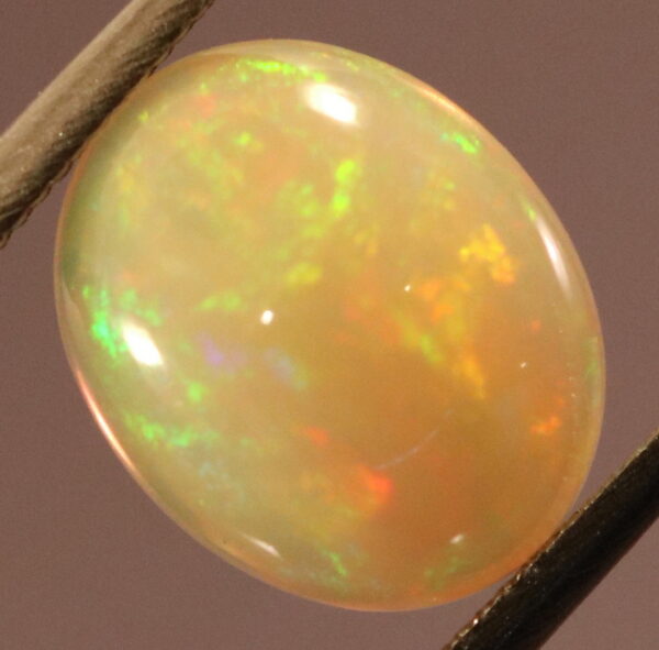 Brilliant flashing 1.83ct semi-black Opal